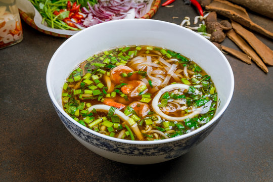 Vietnamese soup Pho with shrimp and squid