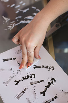Close up of anonymous hands making homemade rubber stamps