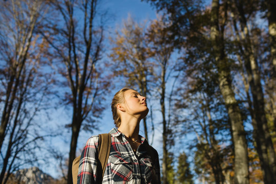 Woman feeling the nature alone in the woods