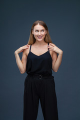 Beautiful blonde woman in black dress