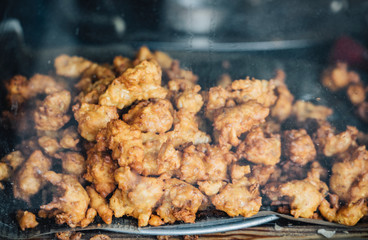 Delicious Pakistani pakoda placed on a newspaper