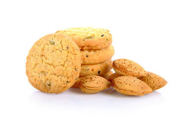 Crackers, grains and almonds on white background