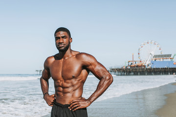Fit man posing at the beach