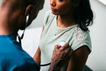 Exam: Doctor Uses Stethoscope To Listen To Heartbeat