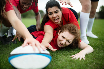 Female rugby players in action