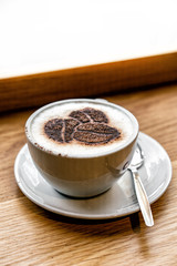 Delicious Cappuccino Coffee, on wooden table