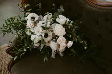 Simple white and green wedding bouquet with vines and white flowers
