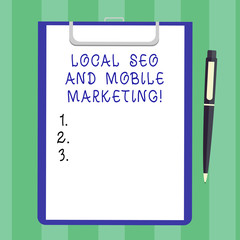 Handwriting text Local Seo And Mobile Marketing. Concept meaning Search engine optimization Digital promotion Blank Sheet of Bond Paper on Clipboard with Click Ballpoint Pen Text Space