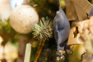 Christmas ball on the tree in the background with other decorations and garlands. copy space.