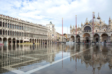 Venice, Italy - November 27, 2018: High water on St. Mark's Square in Venice. St. Marks Square (Piazza San Marco) during flood (acqua alta) in Venice, Italy