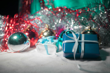 Christmas background with baubles, on snow, free space for text. Christmas decoration.