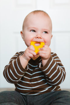 Portrait of a teething baby boy