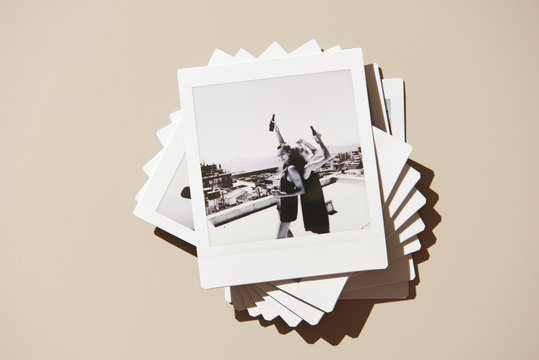 Polaroids with stylish dancing women on rooftop