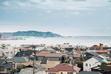 Obraz premium Yuigahama beach and seaside village from Hasedera temple in Kamakura, Japan