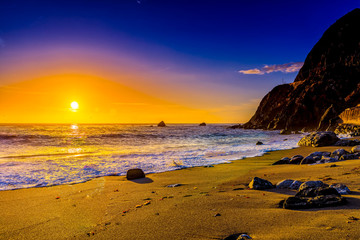 Glowing Ball of the Setting Sun over Ocean