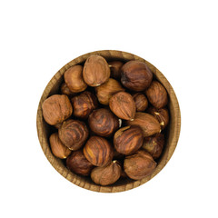Wooden bowl with hazelnuts isolated on white background. The view from the top.