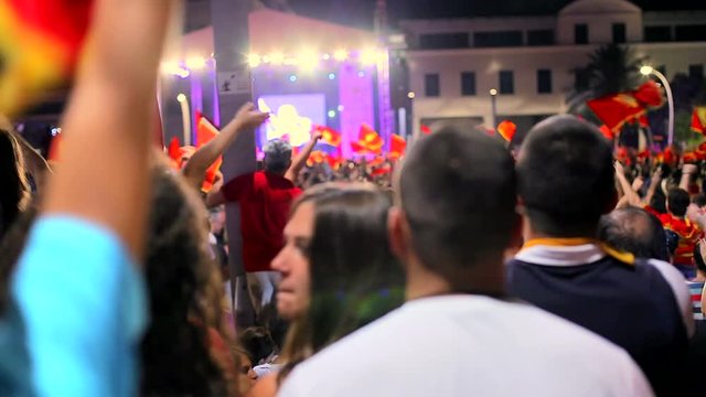 Fans celebrating the victory of their national team at the street