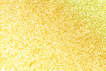 Gold bokeh texture. Festive glitter background with defocused lights.