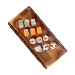 assorti set sushi on wooden board isolated on white background