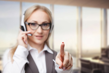 Three call center service operators at work. Portrait of smiling pretty female helpdesk employee...