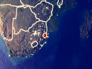 eSwatini from space on Earth at night. Very fine detail of the plastic planet surface with bright city lights.