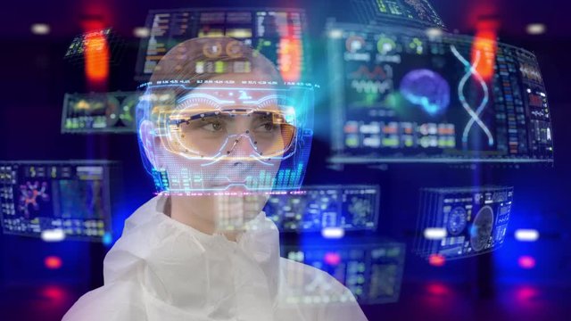 Young female scientist uses futuristic holographic touchscreen UI (user interface) to access data on her virtual reality headset