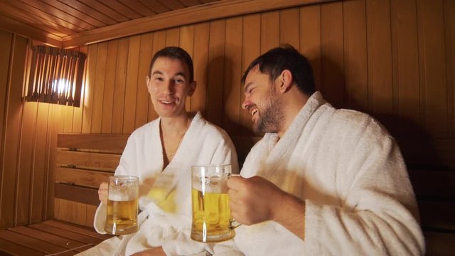 Men relax in the bath, sauna, drink beer