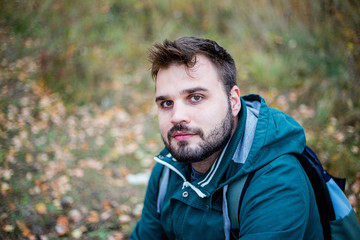 handsome male tourist hiking in the forest