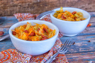 Bigos - stewed cabbage with carrots and smoked sausages , traditional dish of polish cuisine
