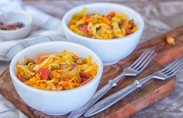 Bigos - stewed cabbage with carrots , smoked sausages and mushrooms, traditional dish of polish cuisine