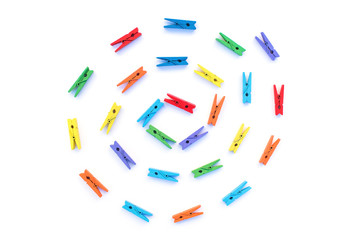 Multi-colored isolated clothespins.