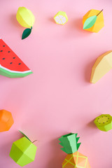 exotic fruits made of paper on pink background
