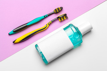 Flat lay composition with manual toothbrushes and oral hygiene product