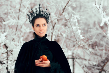 Evil Queen with Poisoned Apple in Winter Wonderland
