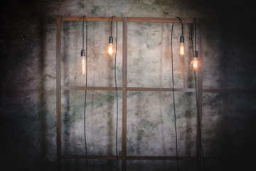 Light bulbs on the wall on a wooden lattice. Texture and background