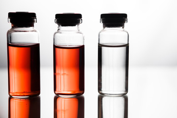 Group of ampoules with a transparent medicine in medical laboratory