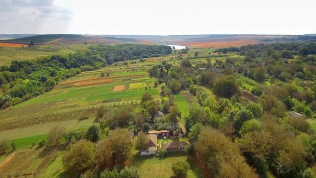 Ascending flight over the country fields and lakes. FullHD 1080p.