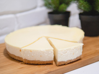 Homemade cheesecake with fresh strawberries and mint for dessert - healthy organic summer dessert pie cheesecake. Vanilla Cheese Cake.