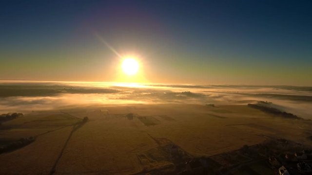Panning drone flight along the field at foggy morning. FullHD 1080p.