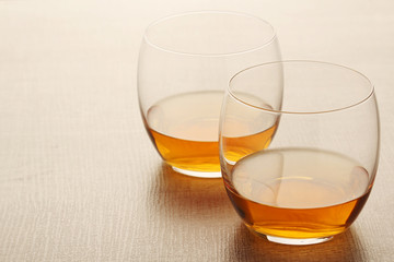 Two glasses with whiskey without ice cubes	