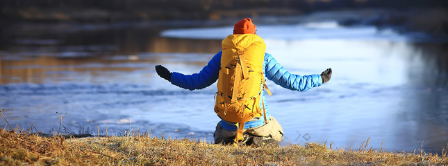 man in a winter hike / yoga rest and meditation in nature, adventure in the north, mountain hike,...