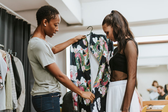 Stylist choosing an outfit for the model