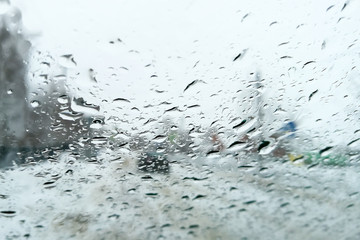 Drops from the rain on the glass of the car as a background
