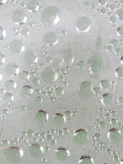 Drops from rain on glass as background