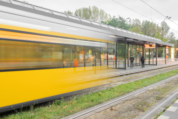 Fototapeta premium A yellow tram in motion