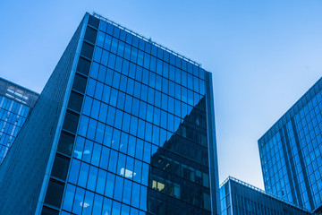 Modern office building against blue sky