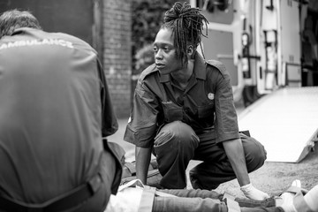 Paramedic team rescuing a young critical patient