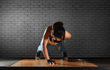 Young good looking woman push up with one hand challenging one self