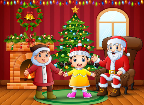 Happy two kids celebration a christmas with santa claus