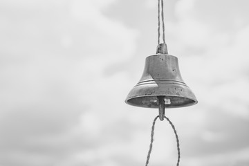 Fototapeta premium the bell hangs on a rope